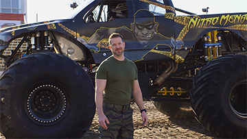 Nick Bolton in front of a monster truck